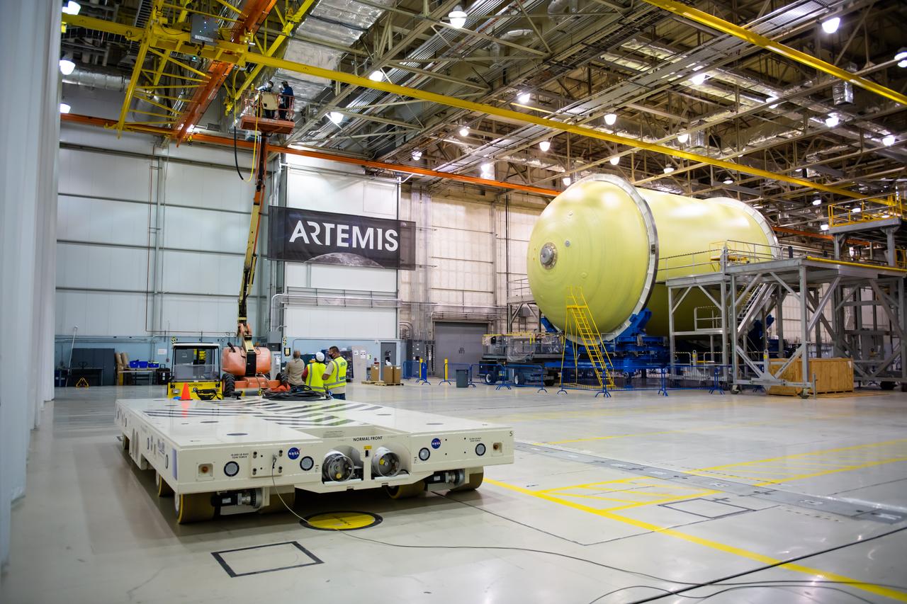 Employees wear personal protective gear at  Michoud Assembly Facility as the facility transitioned to Stage 3 of NASA’s Framework for Return To On-Site Work. Employees wear the appropriate personal protective equipment (PPE) and/or cloth face coverings as required for assigned tasks. Access to the facility is limited to authorized personnel working on mission-critical tasks that must be conducted onsite. Mission-critical tasks include slowly and methodically resuming Space Launch System (SLS) Core Stage and Orion production activities, particularly critical path deliverables to support the Artemis Program, at a pace that limits personnel and follows federal guidelines for social distancing and use of personal protective equipment such as face masks. For more information about SLS, visit nasa.gov/sls.